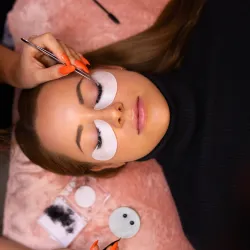 Woman in a salon getting her eyelash extensions