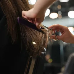 Woman in a salon getting a haircut
